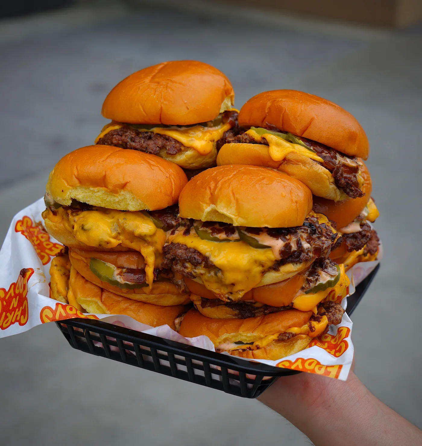A basket of Chris N Eddy's smashed cheeseburger sliders