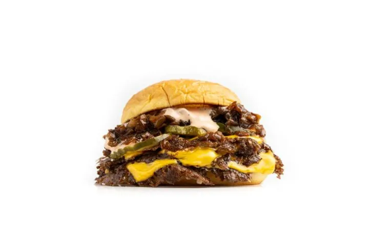 Triple Patty Slider — Three smashed patties on three slices of cheese.