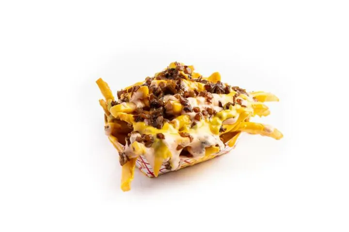 Loaded Fries — Melted cheese, Chris N Eddy’s sauce and grilled onions over the fries.