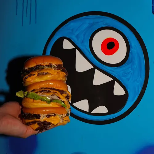 Stacked sliders in front of Chris N Eddy’s monster mural