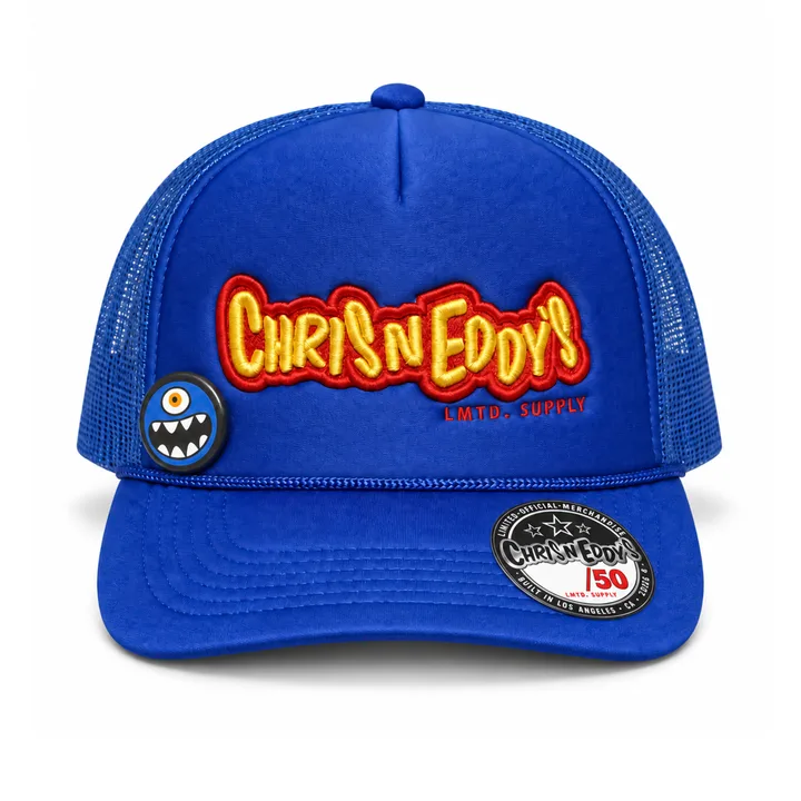 Front of the royal-blue Foam Trucker: yellow 3D puff CHRIS N EDDY’S embroidery with red outline, Cyclops button at wearer-left, /50 sticker on the bill